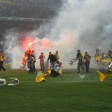 After the final whistle, Fenerbahce fans broke plastic chairs and threw them at the police and Galatasaray players