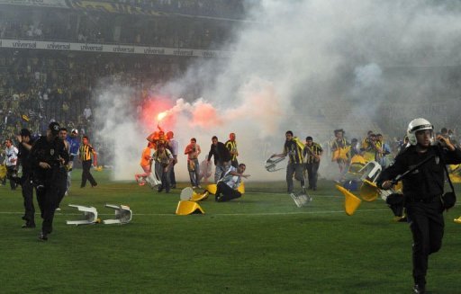 After the final whistle, Fenerbahce fans broke plastic chairs and threw them at the police and Galatasaray players