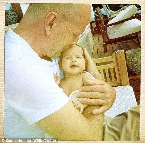 Emma Heming has posted an adorable photo on Twitter of Bruce Willis cuddling little Mabel Ray in his arms