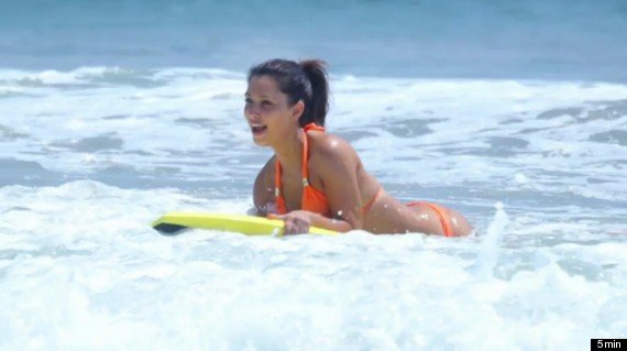 Kim Kardashian sporting a halterneck orange bikini as she hit Mexico beach with sister Kourtney and nephew Mason 