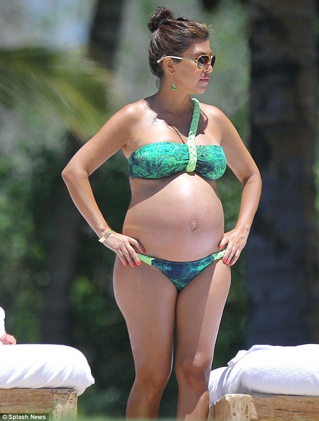 Kourtney Kardashian flaunted her very large baby bump in a bright green bikini during a recent trip to Mexico to celebrate her 33rd birthday