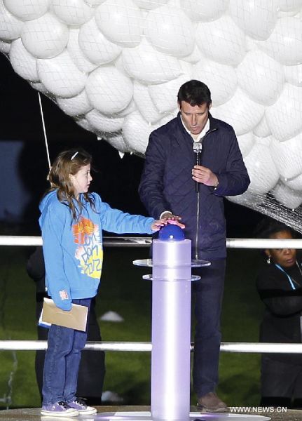 Niamh Clarke-Willis joined LOCOG head Lord Sebastian Coe to hit a button which launched balloons into the sky above London Olympic Stadium for this summer's Games