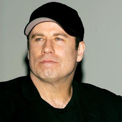 One of the two male masseurs who have claimed actor John Travolta had sexually assaulted them has withdrawn his legal action