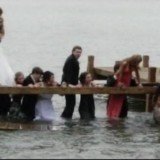 Prom night was almost a complete washout for a group of students from the Kettle Moraine High School, Wisconsin, when they posed for a picture standing on a pier and ended up in the water Prom night was almost a complete washout for a group of students from the Kettle Moraine High School, Wisconsin, when they posed for a picture standing on a pier and ended up in the water