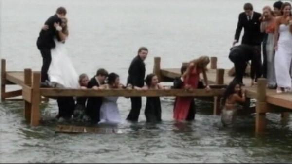 Prom night was almost a complete washout for a group of students from the Kettle Moraine High School, Wisconsin, when they posed for a picture standing on a pier and ended up in the water