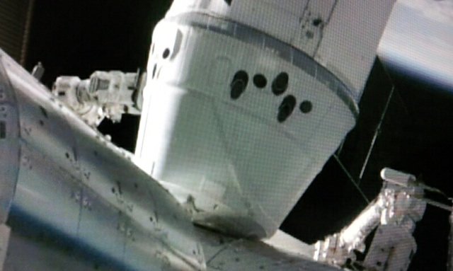 SpaceX unmanned Dragon cargo ship has been successfully attached to the International Space Station (ISS)