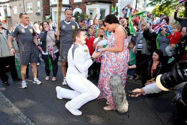 David State, 25, from Redcar, who works with the Scout movement and raises money for charity, knelt as he asked Christine Langham, 27, to marry him