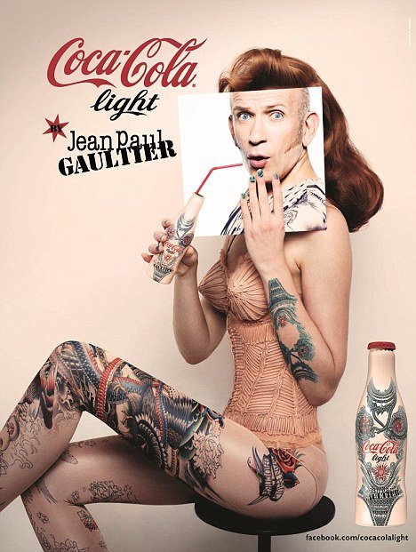 Designer Jean Paul Gaultier has joined forces with Coca-Cola to become the latest member of the body art brigade