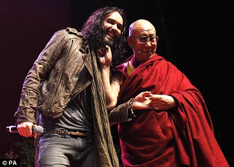 Russell Brand introduced the Dalai Lama during a youth event in Manchester yesterday and admitted he was finding the experience somewhat surreal