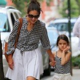 Katie Holmes and Suri are believed to have been riding in the back of a black Mercedes sedan when it was struck by a sanitation truck