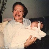Lady Gaga took to Twitter to mourn the death of her godfather and shared a photo of herself in his arms as a newborn baby