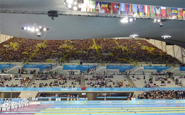 Olympic organizers are investigating why many seats were empty during events at venues including the Aquatics Centre in east London