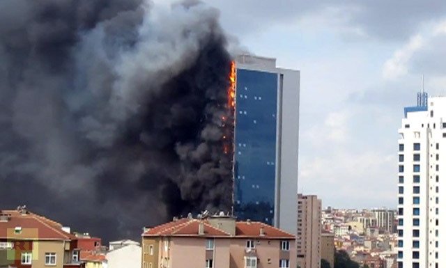 Television footage showed the Polat Tower building engulfed in thick black plumes of smoke, with pieces of debris falling to the ground
