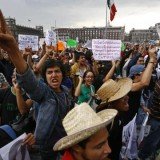 Tens of thousands of people in Mexico City are marching against the result of the presidential election, which was won by Enrique Pena Nieto