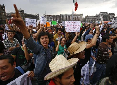 Tens of thousands of people in Mexico City are marching against the result of the presidential election, which was won by Enrique Pena Nieto