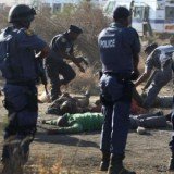 At least 30 people have been killed after South African police clashed with striking miners at Lonmin Marikana mine on Thursday