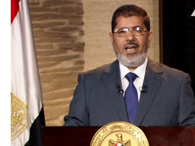 Egypt's President Mohammed Mursi has told Non-Aligned Movement (NAM) summit in Iran that the Syrian uprising is a revolution against an oppressive regime