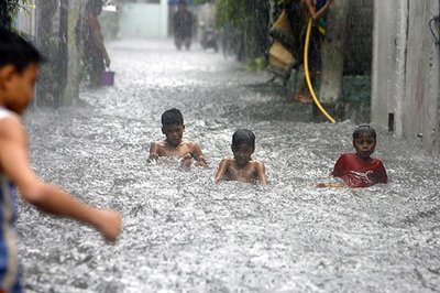 Half of Manila had been hit by floods, with water up to waist and neck levels in some areas