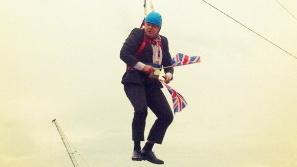 London’s Mayor Boris Johnson was left dangling on a zip wire for several minutes when it stopped working at an Olympic live screen event