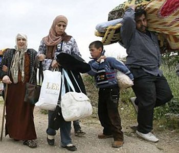 The United Nations refugee agency says that more than 200,000 Syrians have fled to neighboring countries as the conflict has intensified