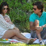 Scott Disick and Kourtney Kardashian covered their baby daughter Penelope in kisses as they took her to the park for a picnic