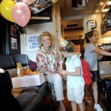 Ann Romney is campaigning for her husband on a bus tour through the swing state with her two grandsons, Parker and Miles