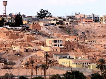 At least 22 people have died in days of fighting in Libya's town of Bani Walid