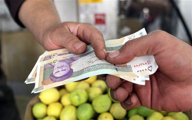 Iranian riot police have clashed with protesters in Tehran over sharp falls in the currency