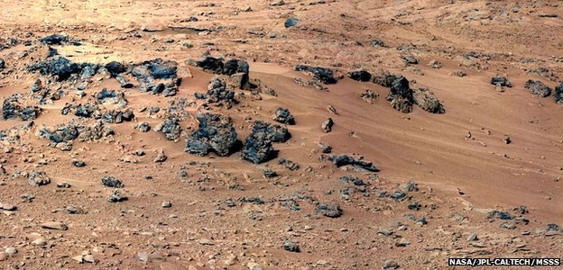 NASA’s Curiosity rover is preparing to scoop its first sample of Martian soil