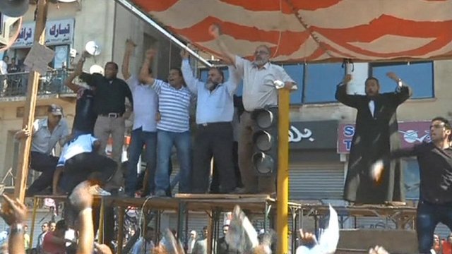 Scores of people were reported injured as supporters and opponents of Mohammed Mursi fought in Tahrir Square