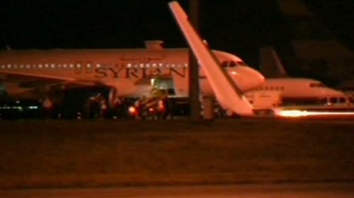 Turkish fighter jets have forced a Syrian passenger plane suspected of carrying weapons to land in Ankara