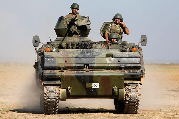 Turkish military has returned fire across the border after a Syrian mortar round again landed on Turkey soil