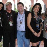 Jill Kelley's twin sister Natalie Khawam, David Petraeus, Scott and Jill Kelley, and Holly Petraeus watch the Gasparilla parade from the Kelley family's front lawn in 2010