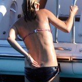 Kate Moss has revealed her supermodel body is quite literally a work of art as she has a tattoo inked by Lucian Freud just above her bottom