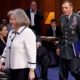 Paula Broadwell was caught gazing at David Petraeus as he entered a congressional hearing with his wife Holly in a photograph from 2011