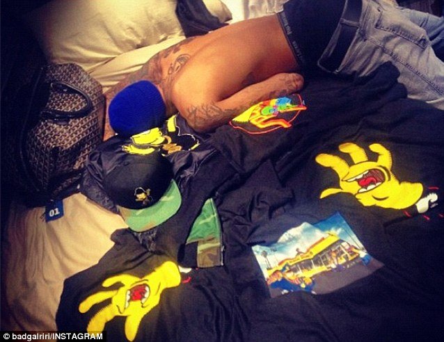Rihanna was Unapologetic about posting an image of Chris Brown topless on a bed surrounded by The Simpsons memorabilia