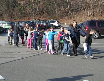 At least 18 children are among the dead at Sandy Hook Elementary School in Newtown