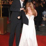 Isla Fisher stole the show from her husband Sacha Baron Cohen in daring plunging white gown at the London premiere of Les Misérables