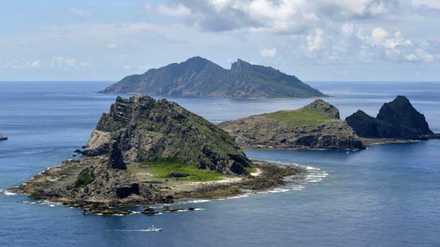 Japan has accused China of violating its airspace for the first time after a Chinese government plane flew near disputed East China Sea islands