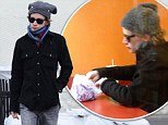 Macaulay Culkin proved that he was doing just fine as he hit the shops to get the last of his Christmas gifts on Saturday, despite starting the day by eating alone at Taco Bell