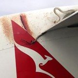 A 10 ft scrub python was battling to retain its grip on the wing as a Qantas plane made its way between the Australian town of Cairns and Port Moresby in Papua New Guinea