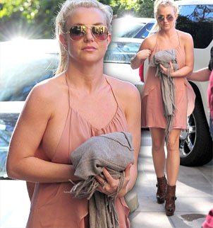 Britney Spears came pretty close to losing part of her dress on her way to lunch on Saturday afternoon