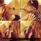 Mariah Carey uploaded an adorable set of photos of her 20-month-old daughter Monroe applying powder to her famous mother's face