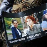 Turkish Prime Minister Recep Tayyip Erdogan has called on French President Francois Hollande to explain why he previously met one of the Kurdish activists shot dead in Paris on Thursday