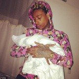 Amber Rose posted a picture of her new son, Sebastian “The Bash” Taylor Thomaz being cradled by his father Wiz Khalifa