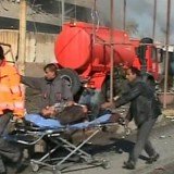 At least 30 people have been killed after gunmen and a suicide bomber attacked a police headquarters in the northern Iraqi city of Kirkuk