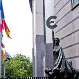 European Union officials have struck a provisional deal on new financial rules, including capping bank bonuses