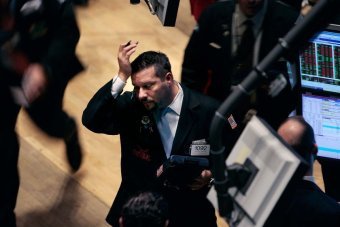 Global stock markets have fallen after some members of the Federal Reserve suggested its stimulus measures may be increasing the risks of future economic and financial imbalances