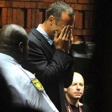 Oscar Pistorius has strongly rejected a charge that he murdered his girlfriend, Reeva Steenkamp