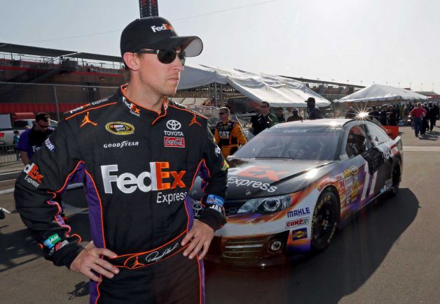 Denny Hamlin remains hospitalized overnight after being airlifted to a local hospital after a hard single-car crash at the inside wall on the final lap of Sunday's Auto Club 400